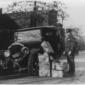 Policeman_and_wrecked_car_and_cases_of_moonshine.jpg